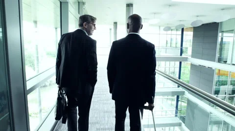 Two Business man walking in office lobby Vídeo Stock 59398036