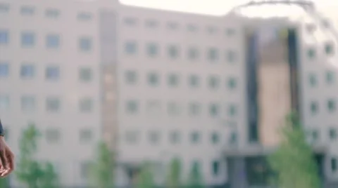 Two business men shake hands against business center background Stock-Footage 68972151