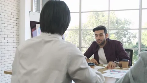 Two business men shaking hands with company partnership agreement. Stock Footage 153889571