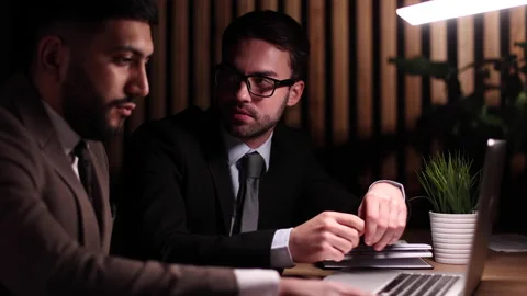 Two business men sitting in the office, meeting or job interview. Stock Footage 238044975