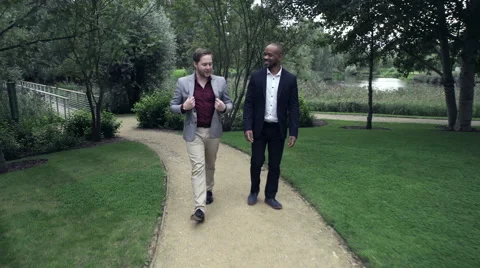 Two Business men walking in lawn Vídeo Stock 59402149