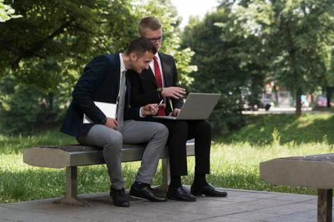 Two Business Men Working On A Computer Stock Photos