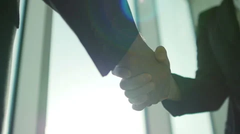 Two business partner shake hands when meeting. In slow motion Video stock 53848244