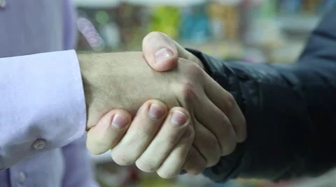 Two business partner shake hands when meeting. Video stock 64050479