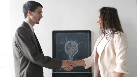 Two business partner shake hands when meeting between a man and woman in suit Stock Footage 108101381