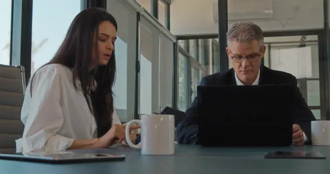 Two business partners having a meeting in an office to discuss a new project. Stock Footage 139920839