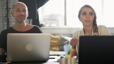 Two business partners in the office are asking for two cups of coffee. Co Stock Footage 90491045