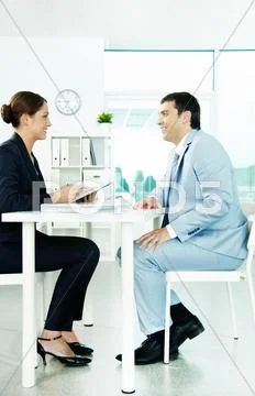 Two business partners sitting in office and planning work Stock Photos