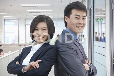 Two Business People with Arms Crossed Stock Photos
