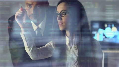 The two business people drawing on virtual screen Video stock 76206777