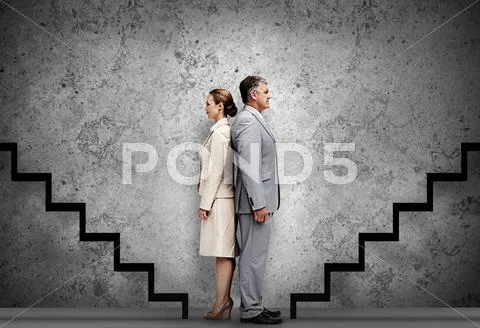 Two business people facing career progression Stock Photos