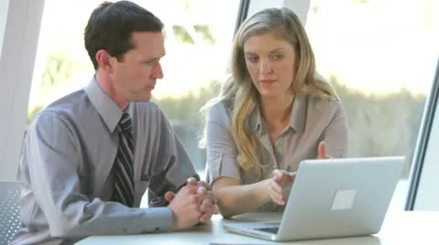 Two Business People With Laptop Having Meeting Stock Footage