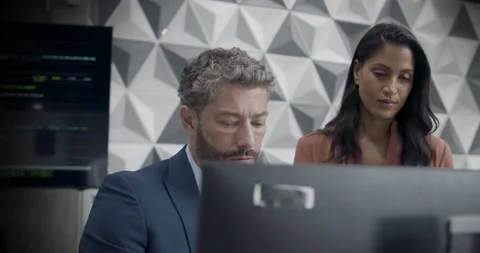 Two Business People Looking at Computer in Cyber security Office Stock Footage 246674045