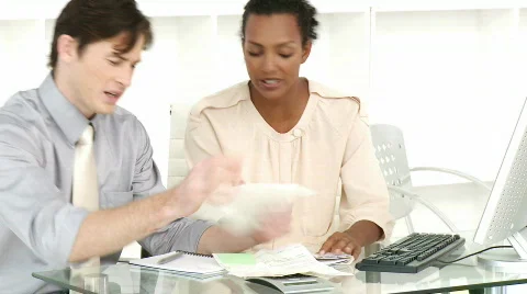 Two business people stressed with so many bills to pay Stock Footage