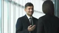 The two business people talk in the office hall. slow motion 4k or 4k+ Resolution