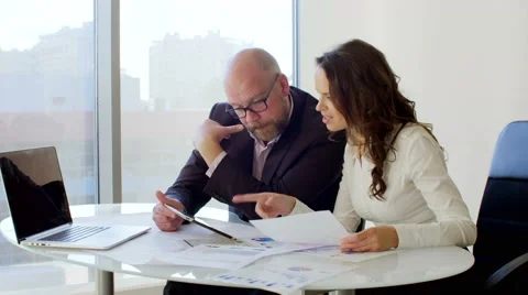 Two Business people working with tablet. They discussing business ideas sitting 動画素材 68574158