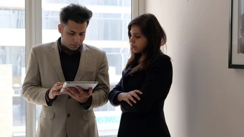 Two business plan discussing their strategy and workflow for a upcoming meeting  Stock Footage 100629285