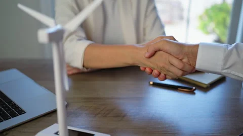 Two business professionals sealing clean energy deal with firm handshake ov.. Stock Footage 346305476