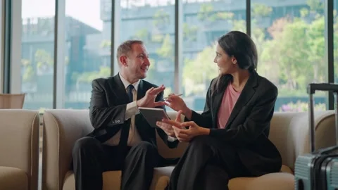 Two business signing a digital document on tablet with stylus and shaking hands Stock Footage 330522105