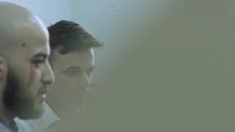 Two business workers discussing in office and looking at computer monitor Stock Footage 105811225