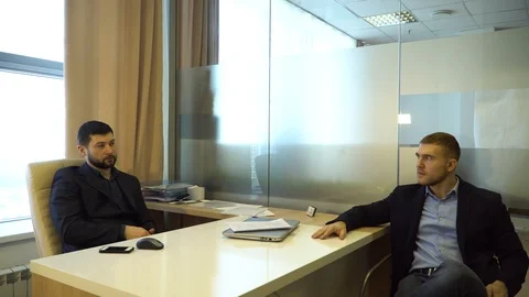 Two business young people talking at the office Stock Footage 85670053