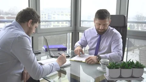Two businessman, associates, talking, drinking coffee, in work, in office Vidéo 73225150