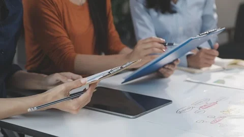 Two Businessman Calculating Bills Using Calculator At Workplace. Business t.. Stock Footage 328996332