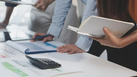 Two Businessman Calculating Bills Using Calculator At Workplace. Business t.. Stock Footage 328996473