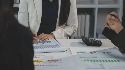 Two Businessman Calculating Bills Using Calculator At Workplace. Business t.. Stock Footage 328996654
