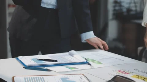 Two Businessman Calculating Bills Using Calculator At Workplace. Business t.. Stock Footage 328996671