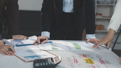 Two Businessman Calculating Bills Using Calculator At Workplace. Business t.. Stock Footage 328996675