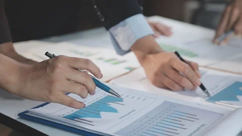 Two Businessman Calculating Bills Using Calculator At Workplace. Business t.. Stock Footage 328996705