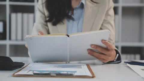 Two Businessman Calculating Bills Using Calculator At Workplace. Business t.. Stock Footage 328996747