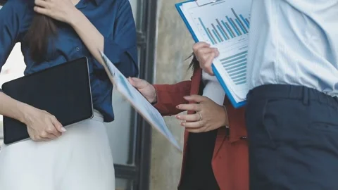 Two Businessman Calculating Bills Using Calculator At Workplace. Business t.. Stock Footage 328996840