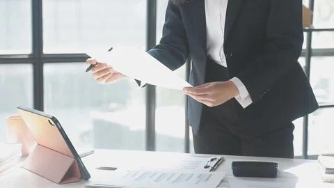 Two Businessman Calculating Bills Using Calculator At Workplace. Business t.. Stock Footage 328996884