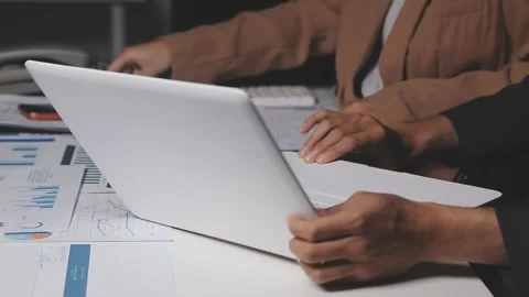 Two Businessman Calculating Bills Using Calculator At Workplace. Business t.. Stock Footage 328997260