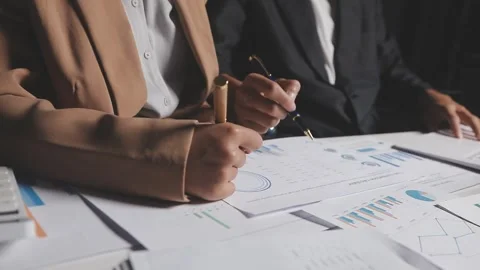 Two Businessman Calculating Bills Using Calculator At Workplace. Business t.. Stock Footage 328997338