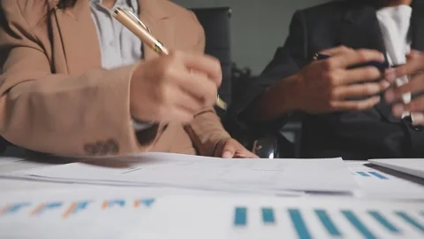 Two Businessman Calculating Bills Using Calculator At Workplace. Business t.. Stock Footage 328997369