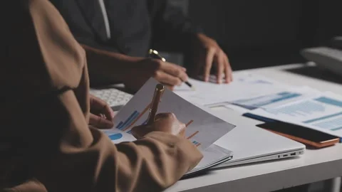 Two Businessman Calculating Bills Using Calculator At Workplace. Business t.. Stock Footage 328997464