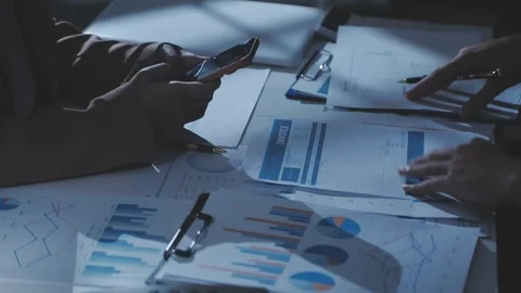 Two Businessman Calculating Bills Using Calculator At Workplace. Business t.. Stock Footage 328997628