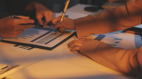 Two Businessman Calculating Bills Using Calculator At Workplace. Business t.. Stock Footage 328997649