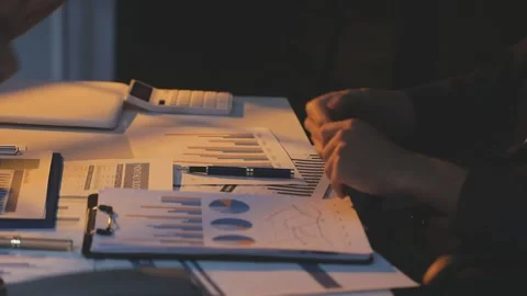 Two Businessman Calculating Bills Using Calculator At Workplace. Business t.. Stock Footage 328997748