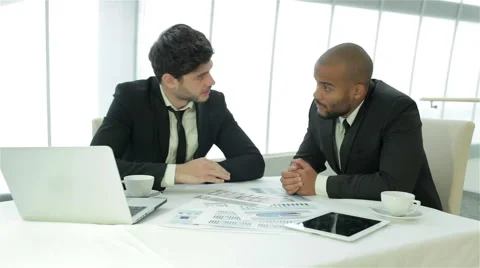 Two businessman discussing documents Stock Footage 43492938