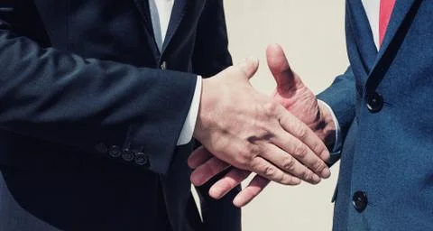 Two businessman handshaking process Фото