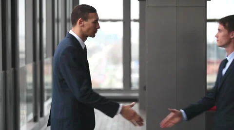 Two businessman shaking hands Stock Footage 59543517