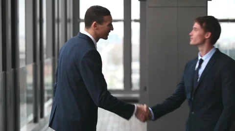 Two businessman shaking hands Stock Footage 59543519