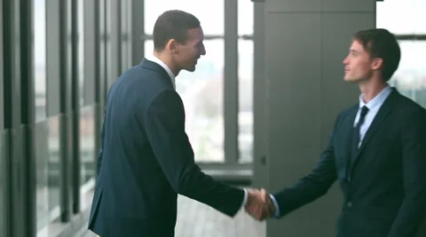 Two businessman shaking hands Stock Footage 59543524