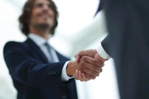 Two businessman shaking hands greeting each other Stock Photos
