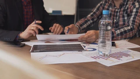 Two businessmen analyze the graphs Stock Footage 86489784