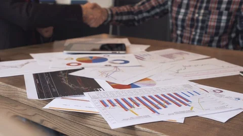 Two businessmen analyze the graphs Stock Footage 86489842